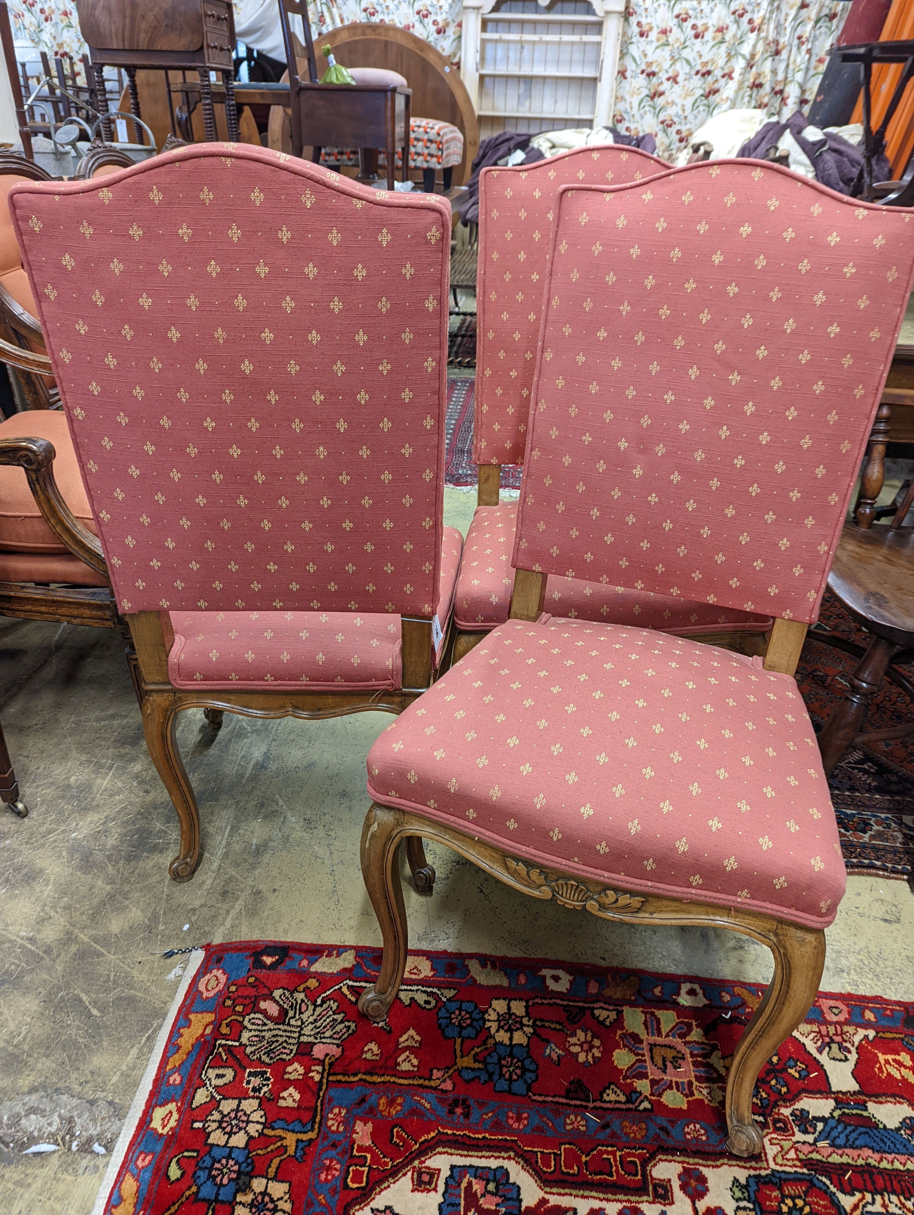A set of eight French walnut dining chairs